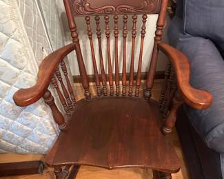 Vintage scroll top rocking chair