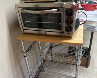 Metal stand with wooden top, Kitchenaid countertop oven, & GE spacemaker