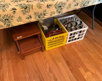 Wooden step stool, yellow tote gas trays, wire shelves, pizza pan & miscellaneous kitchen items; white crate has baking items