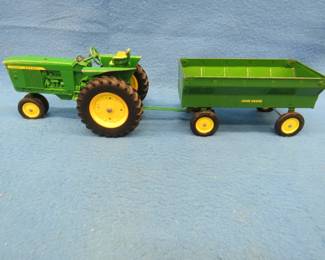 Lot 97. John Deere die-cast tractor and flare-side wagon