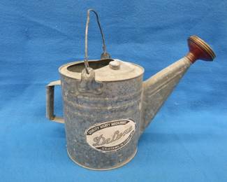 Lot 375. Vintage 8-quart galvanized watering can.&nbsp; Still has the original paper label.
