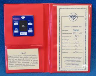 Lot 305. .57 carat Topaz with certificate