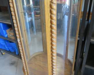 Lot 37. Curved glass lighted 38'W x 54"H x 15"D china hutch with three glass shelves in excellent condition