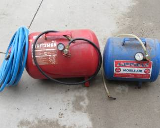 Lot 337. Two compressed air tanks and one hose