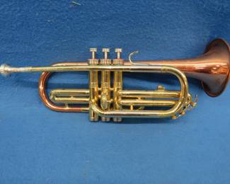 Lot 363. Conn coronet with a case and 2 mutes