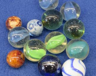 Lot 152. Ten shooter and three vintage clay marbles in a {#}2 Blue Ball jar