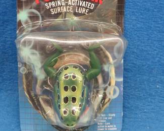 Lot 264. Powerpak spring-operated frog bait. String does not retract.