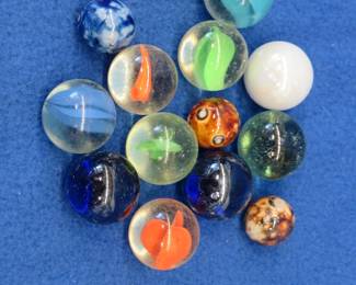 Lot 154. Ten shooter and three vintage clay marbles in a {#}8 Blue Ball jar