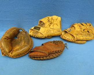 Lot 42. Four vintage RH baseball mitts including a catcher's mitt and a 1st basemen's