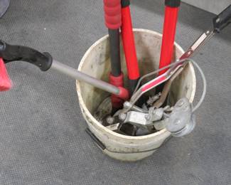 Lot 371. 5-gallon bucket with snow brushes, a come-along, and more