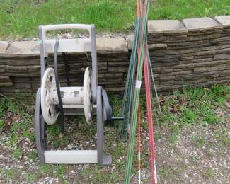 Lot 203. Hose reel and garden stakes
