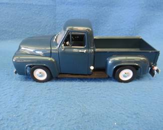 Lot 163. Road Signature 1953 Ford F-100 Pick Up.&nbsp; 1:18 scale die-cast truck with box.