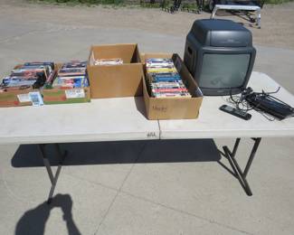 Lot 295. Action TV/VCR with 4 boxes of almost all westerns VHS video tape movies. Lots of John Wayne