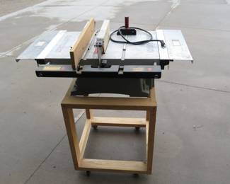 Lot 333. Craftsman 2.7 HP table saw on a rolling cart