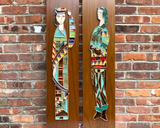 A pair of his and hers Harris Strong colorful tiles on wood panels. 