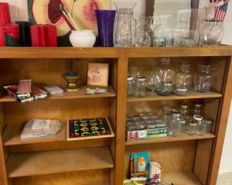 Bookcase, mason jars, floral, vases, and candles,
