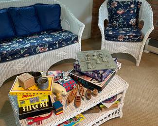 Quite wicker loveseat, white wicker patio chairs (pair available), and coffee table- Great games, puzzles, and nautical decor