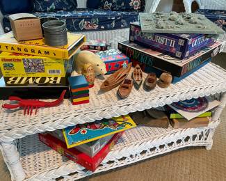 White wicker coffee table 2-tiered, games , and puzzles