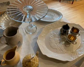 Tall footed cake plate, turkey platter, sauce pitchers and trays