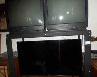 Large flat screen and others  also steel frame set up and other working tv's