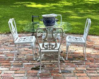 glass top iron table and 4 chairs