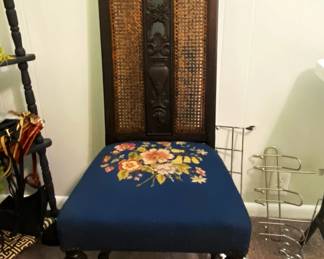 cane back, carved center slat chair with needlepoint seat