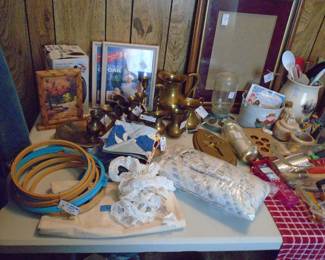 Lots of bedding for full size beds including waffle weave blankets, sheets, etc.  Several embroidery hoops and book on needlepoint. Many small items throughout the house.