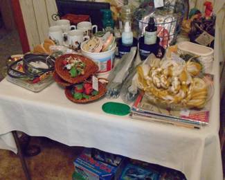 2 Pheasant Pillows to adorn your couch or recliner. Puzzles beneath the table.  Gold and White Macrame vintage 1960's era Plant Holder. And not in the picture but we just added a Horse Collar and an early Saddle!