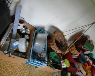 Note the hanging basket. It is an older one.  Lots of battery operated flashlights. Blue stackable baskets in the center.  Bird seed feeders too.