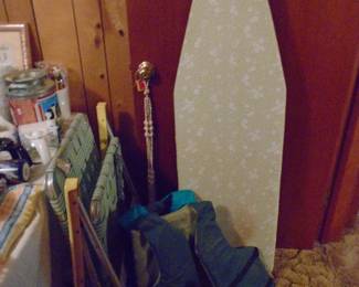 2 life jackets, an ironing board, and fold up aluminum chairs.