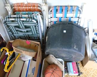 The black tub on the right is laying on it's side, but it is to provide water to livestock. Several folding chairs here as is.  Note the Little Playmate Coolers. I think we have 4 or 5?