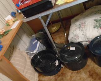 Special note: to the far left you will notice CONCRETE Blue Birds. Two pieces of Capodimonte. Some granite ware cookers and a roaster. We have several beautiful bedspreads (full size) for sale.