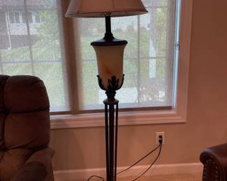 Antiqued Metal Base Floor Lamp with lit globe, neutral shade and 3 way lighting