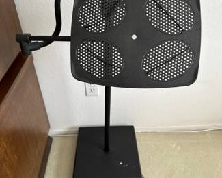 Book or  music or paperwork Holder has four adjustable corner elastics plus it adjusts vertically and swivels, and rolls to where you need it, when you need it