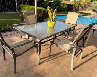 Patio table has four chairs  with matching pieces available