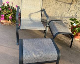 Another chair and two ottomans match patio table
