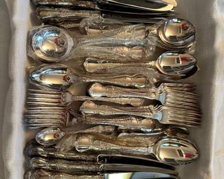 Set for 12 fancy silver plate flatware set with 4 servers, 88 pieces in all most still new in packages, good quality