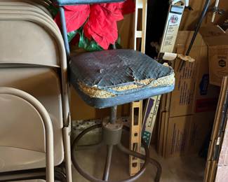 Seat cover is a project but super cool tall bar swivel seat, skis, poles, long level