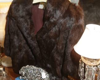 ONE OF THREE FUR COATS