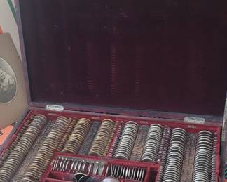 Late 20s early 30s Optician case with lenses and eye charts