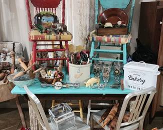Dining table with 4 wooden chair.  Also pictured two light metal chairs