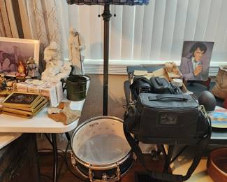 Floor lamp, snare drum, cameras