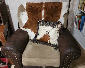 Chair with small cow hide rug and pillow