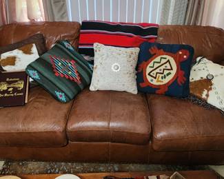 Leather sofa and variety of pillows