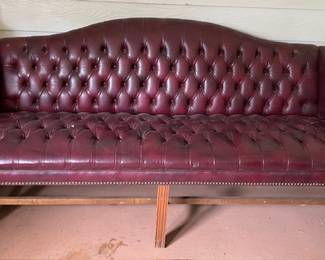 red (faux) leather sofa 70"L
