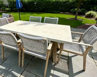 Beautiful outdoor Dining Table and 6 Chairs by Outdoor Interiors and purchased at Wannemaker's in Downers Grove.  The Wood is Teak and the chairs have a Rope Style Netting.  