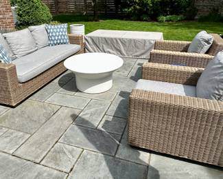 Here is a Sideview Shot of the Wicker Furniture. Pottery Barn Wicker Sofa with Sunbrella Cushions in Excellent Condition.  The Set includes 2 Matching Chairs and Cushions as well as Custom Pottery Barn Covers