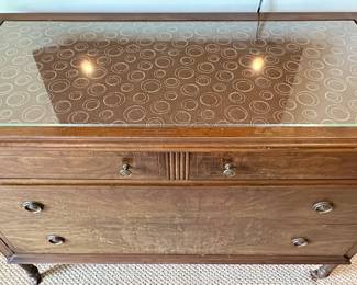 This is a unique vintage dresser with a modern top. 