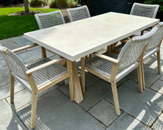 Beautiful outdoor Dining Table and 6 Chairs by Outdoor Interiors and purchased at Wannemaker's in Downers Grove.  The Wood is Teak and the chairs have a Rope Style Netting.  