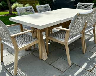 Beautiful outdoor Dining Table and 6 Chairs by Outdoor Interiors and purchased at Wannemaker's in Downers Grove.  The Wood is Teak and the chairs have a Rope Style Netting.  